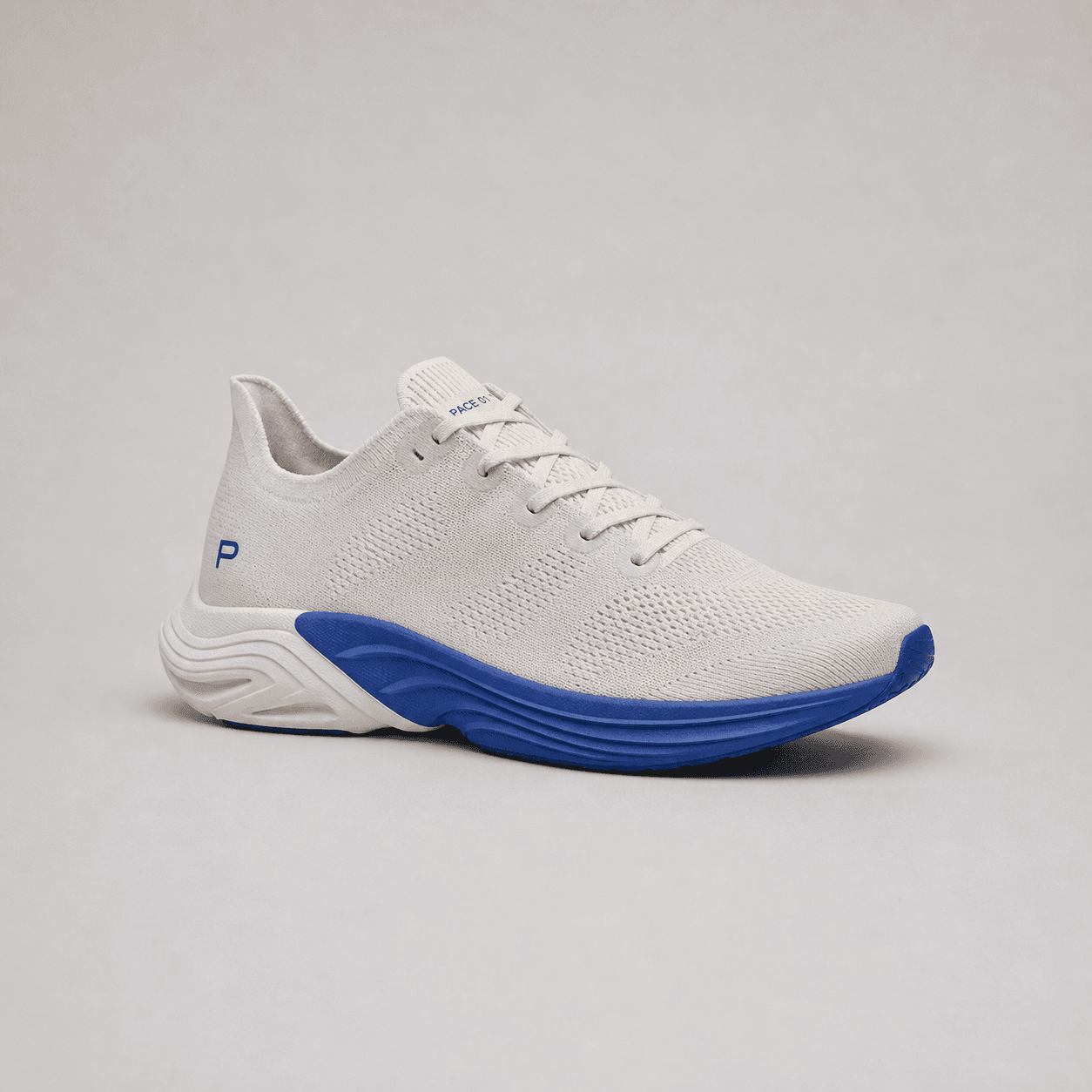 Demo source photo of a fictional PACE 01 running shoe on a neutral studio set