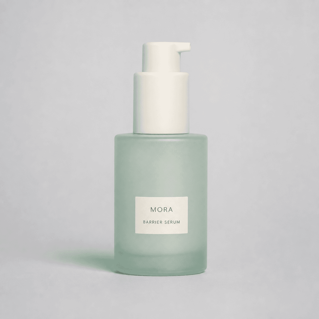 Demo source photo of a fictional MORA barrier serum bottle on a neutral studio set